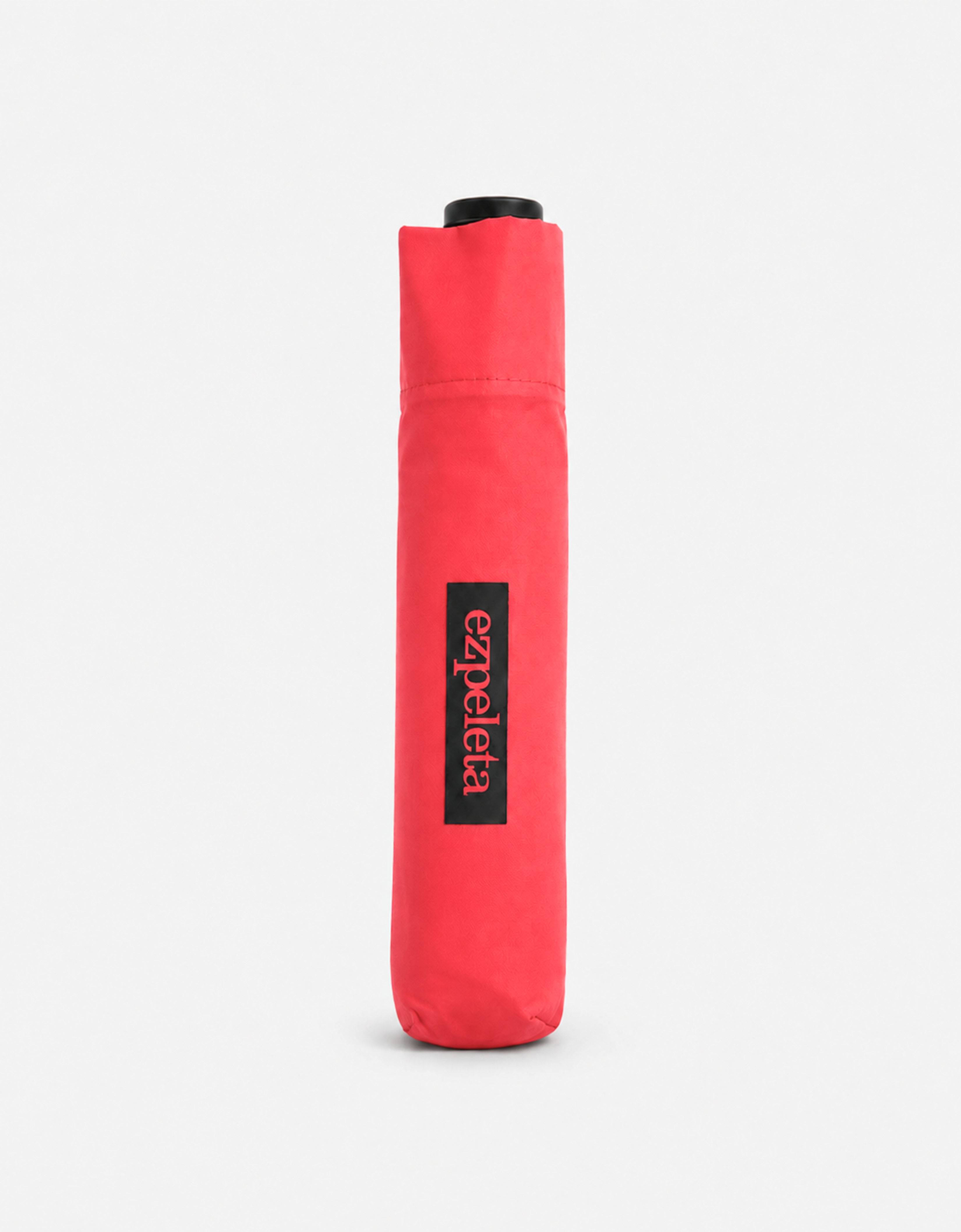 Paraguas ultraligero plegable de la marca EZPELETA, abierto y compacto para protección contra la lluvia en color negro.
